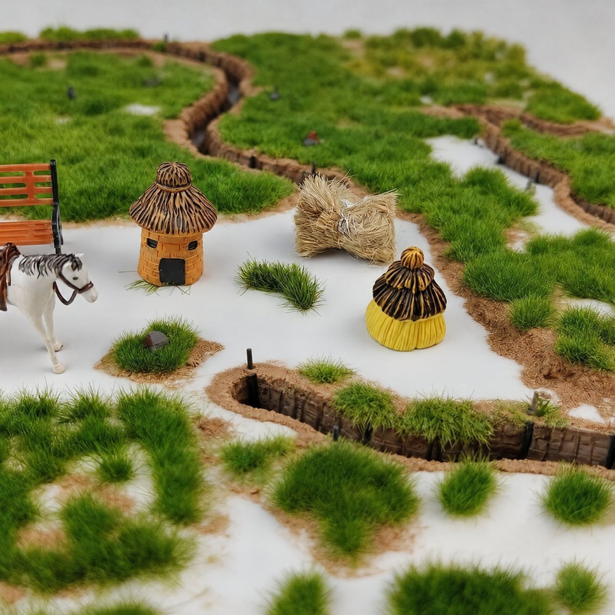 Tearing irregular grass clumps from backing film - Wargame Base World
