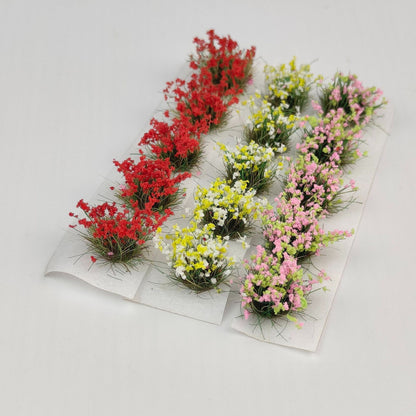 Miniature figures in flower-filled garden scene - Wargame Base World