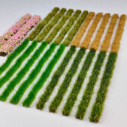 Hand holding a sheet of 5mm strip grass tufts showing scale - Wargame Base World